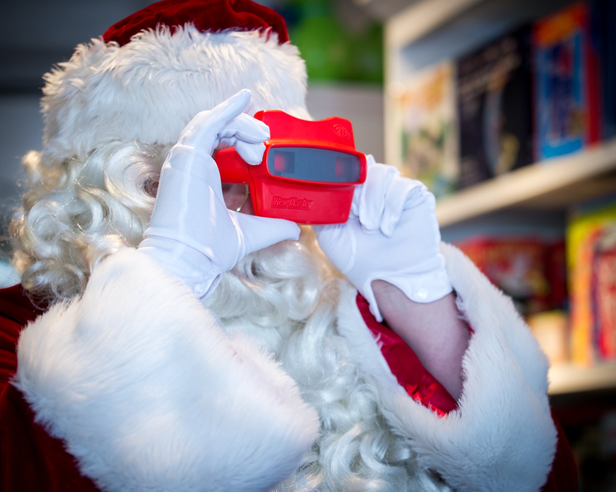 Santa with a View-Master at Play, a Logan Square toy store