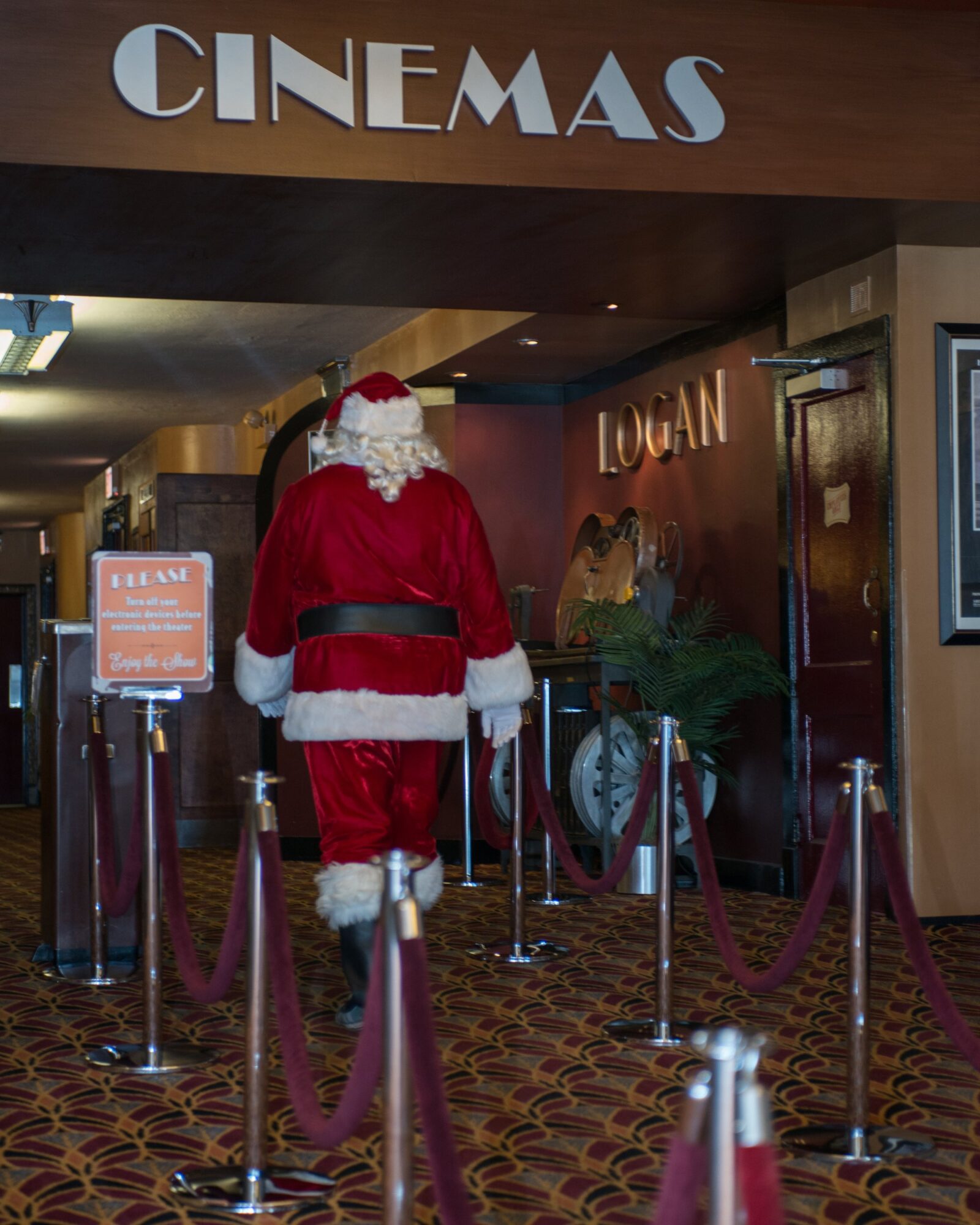 Santa in the lobby of the Logan Theatre