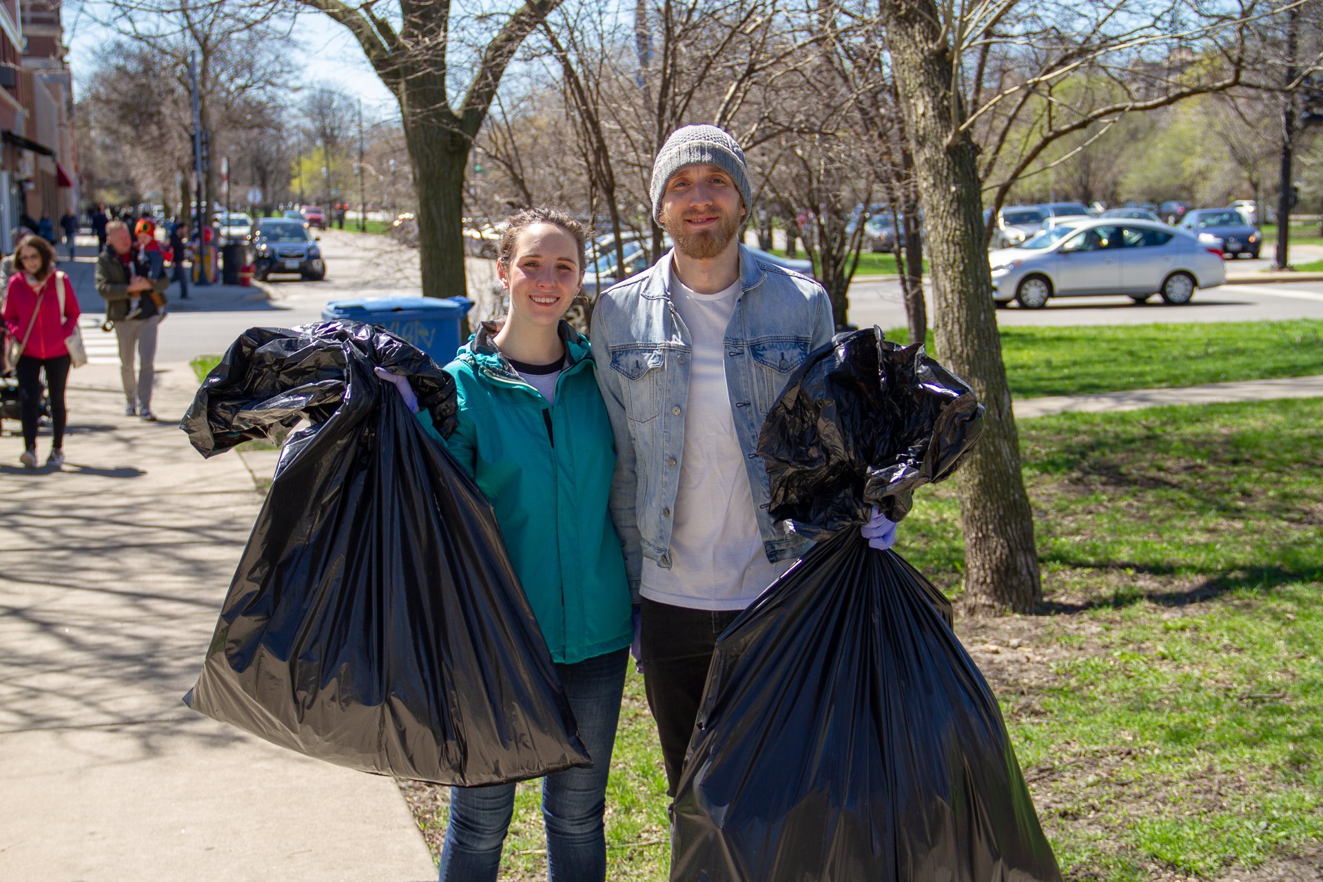 Volunteers with full trash bags at LoganSquarist's 2019 Earth Day cleanup in Logan Square