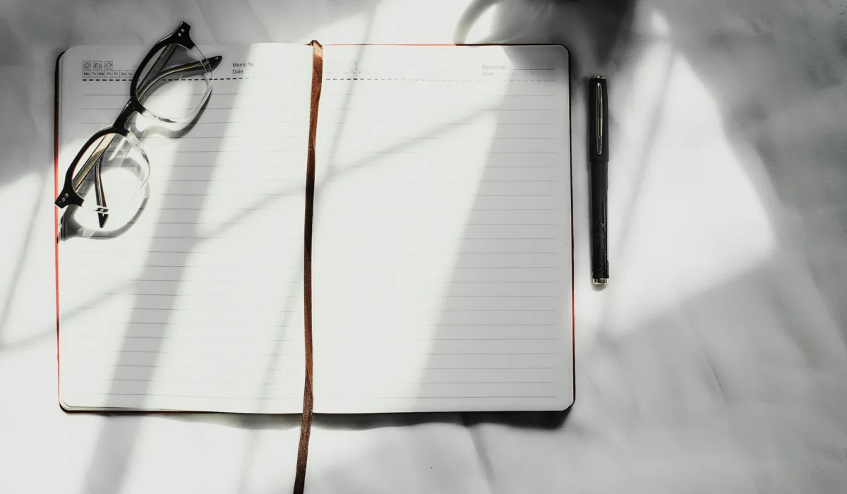 Clean white workspace with desk accessories