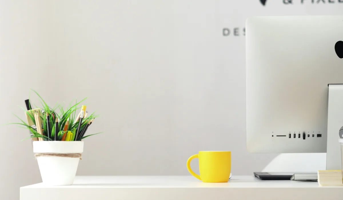 Minimal desk setup with neutral tones and workspace accessories