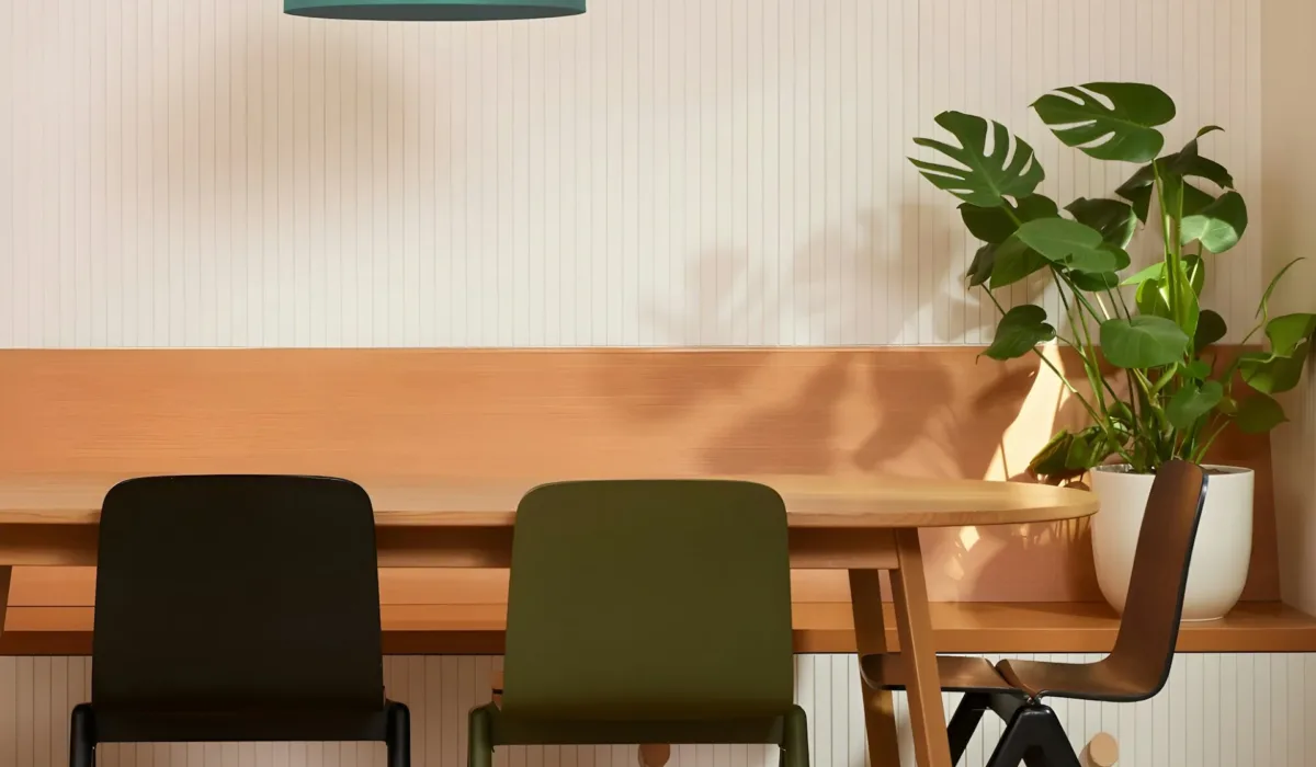 Leadership team gathered around a conference table during a brand strategy workshop, representing the challenge of making organizational narrative accessible and transferable