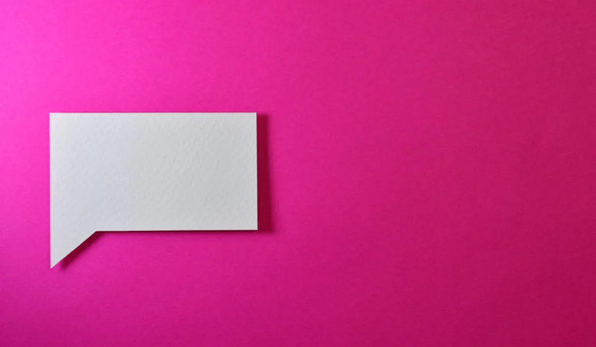 Chat bubble on bright pink background
